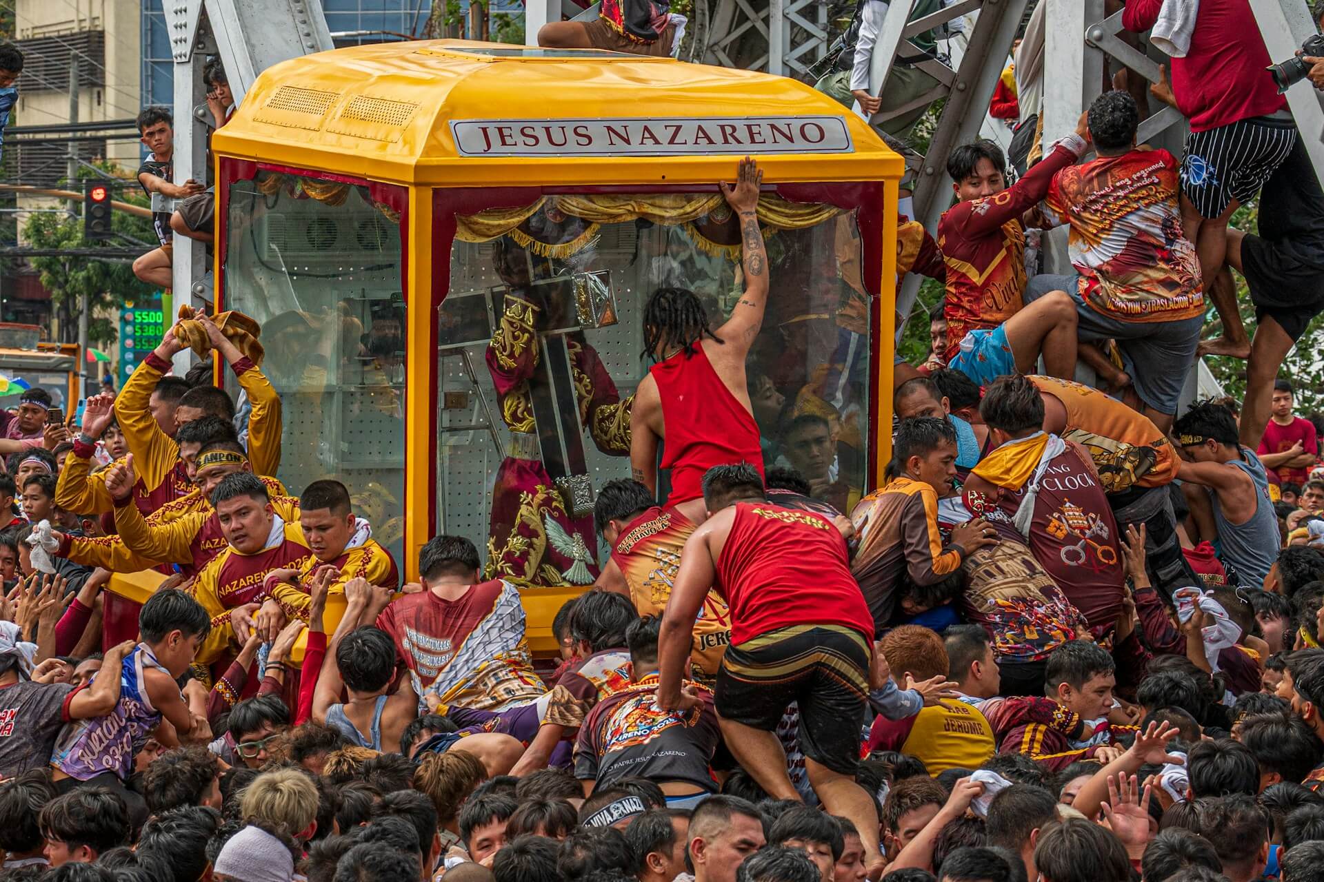Crowd Gathers Around a Religious Procession Float